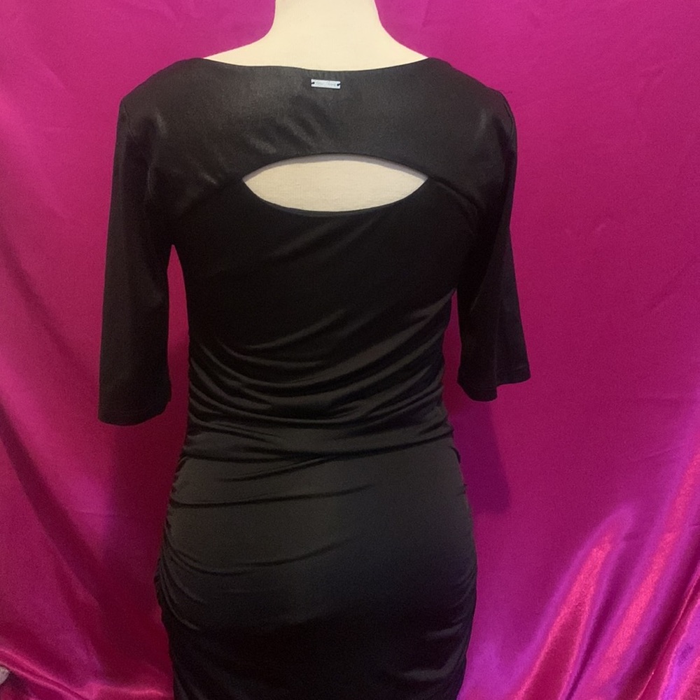 Foxy jeanβs Couture size S black 3/4 sleeve dress. Exposed chest and back